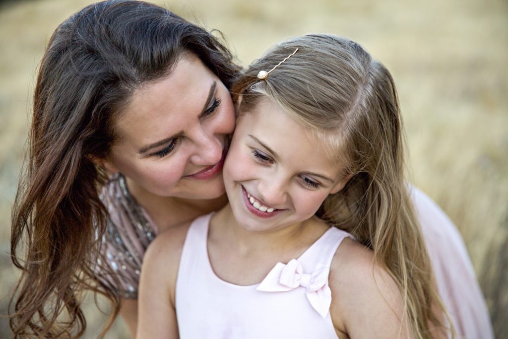 mother behind daughter